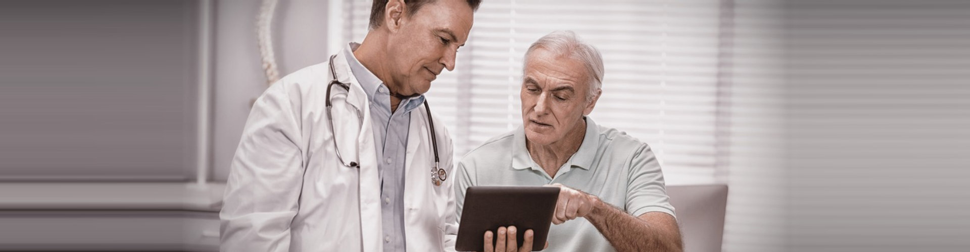 doctor showing the results to elderly